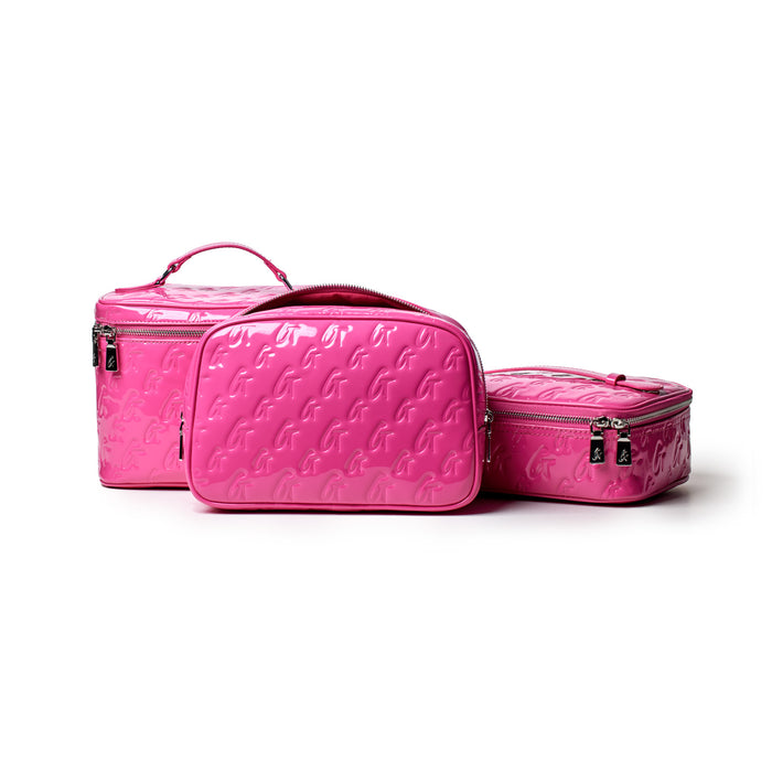 Medium hot pink monogram toiletry bag set with embossed G pattern, featuring zippers and a handle for travel organization.