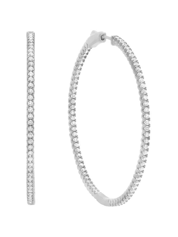A pair of medium pave hoop earrings in platinum, featuring a series of round cuts on the hoop.