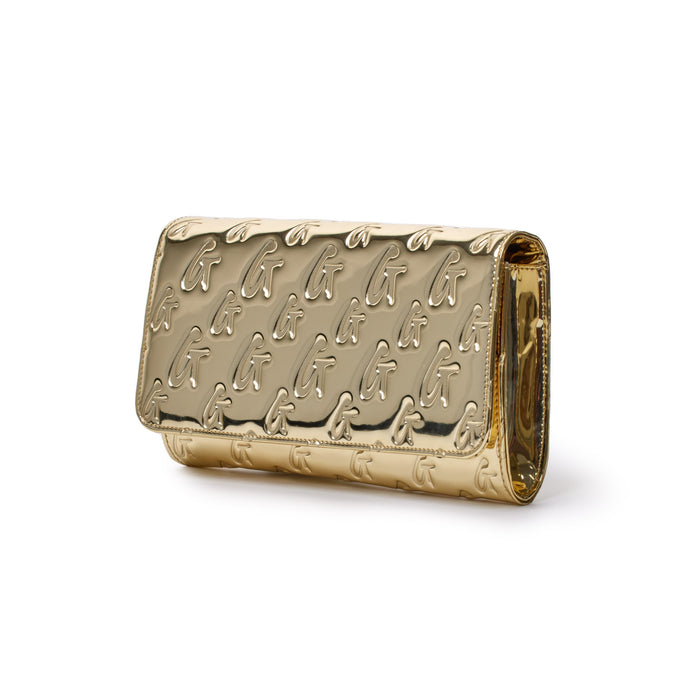 Metallic gold travel wallet with embossed monogram G pattern, sleek rectangular design, and shiny finish.