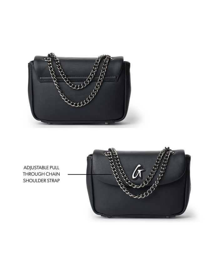 Mini standard flap bag in black featuring an adjustable pull-through chain shoulder strap for versatile styling.