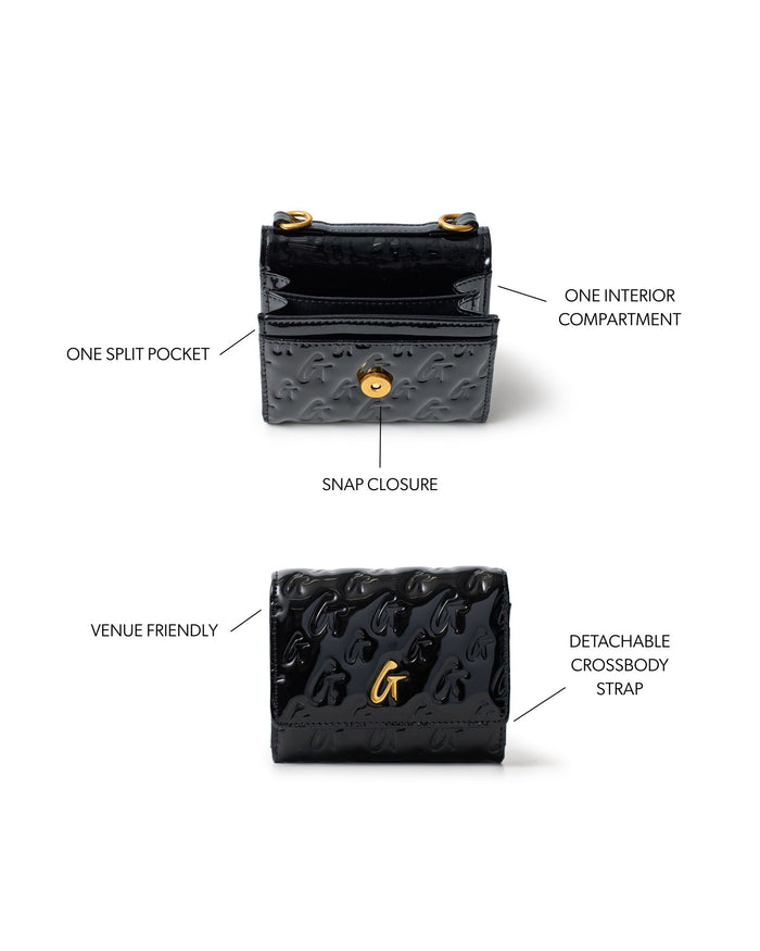 Compact black wallet on chain with gold monogram design, snap closure, and detachable crossbody strap.