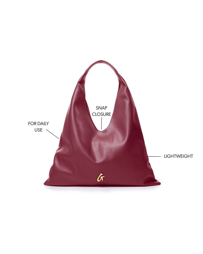 Burgundy Pebble Hobo Shoulder Bag with snap closure, designed for daily use and lightweight for easy carrying.