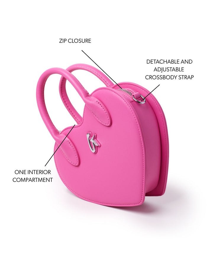 Pink heart-shaped handbag featuring a zip closure, one interior compartment, and a detachable adjustable crossbody strap.