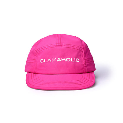 Hot pink athletic 5-panel hat featuring the word "GLAMAHOLIC" prominently displayed on the front.