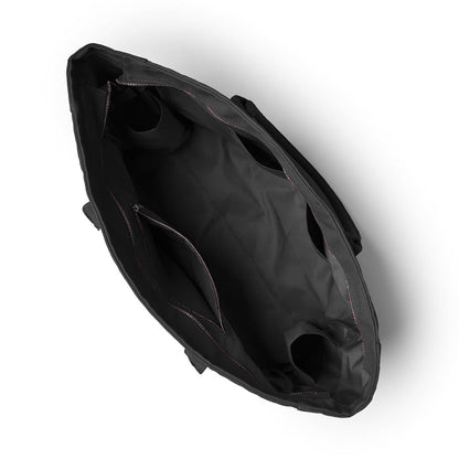 Black athletic canvas tote bag viewed from above, showcasing spacious interior with pockets and sturdy handles.