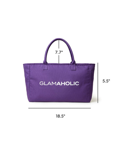 Purple athletic canvas tote bag with sturdy handles and Glam-Aholic logo, measuring 18.5 x 7.7 x 5.5 inches.