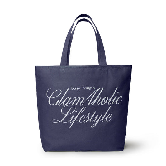 Navy canvas tote bag featuring "busy living a GlamAholic Lifestyle" in elegant white lettering. Ideal for stylish everyday use.