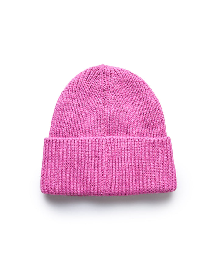 Pink knit beanie hat with a folded cuff, perfect for cold weather and stylish casual wear.