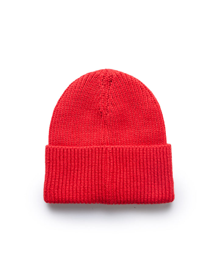 Red knit beanie hat with a folded brim, classic style, and textured ribbed pattern.