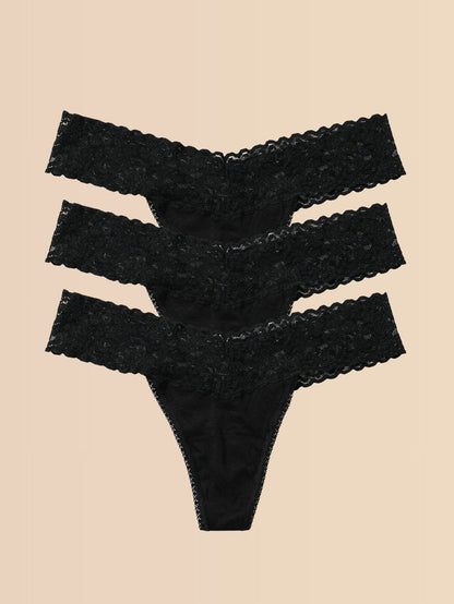 Black DreamEase™ Low Rise Thong 3-Pack Flat Lay on Cream - Lace Thongs | Hanky Panky