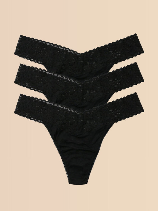 Black DreamEase™ Original Rise Thong 3-Pack, Flat Lay on Cream Background | Hanky Panky