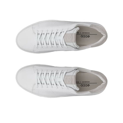 Pair of white leather sneakers showing laces and inner lining label area.