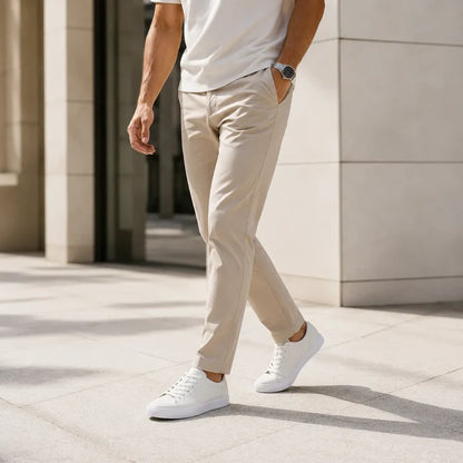 Men's leather lace-up sneakers on model, white low-top with laces and white outsole