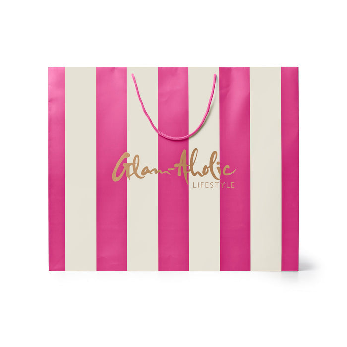 Large pink and cream striped gift bag featuring the Glam-Aholic Lifestyle logo, perfect for stylish gifting.