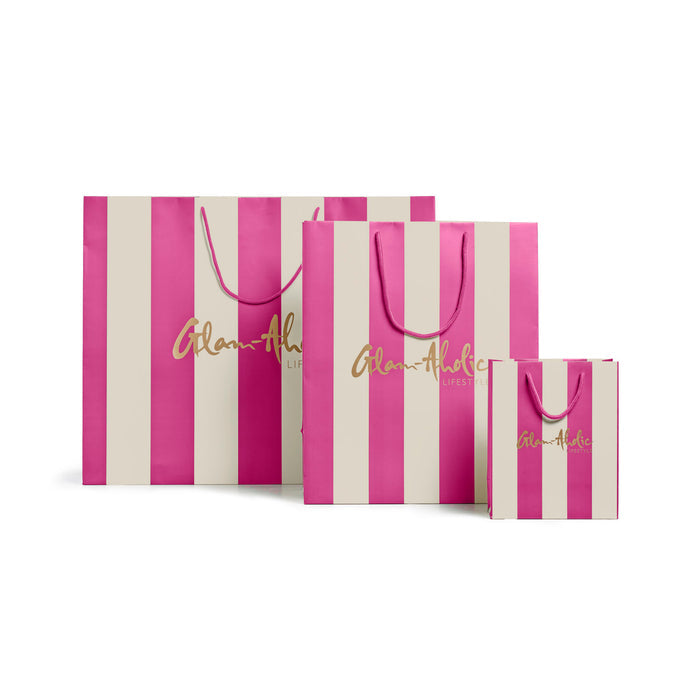 Large pink and cream striped gift bags with Glam-Aholic Lifestyle branding, perfect for stylish gifting.