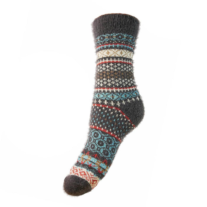 A pair of grey, blue, and white Nordic patterned wool socks.