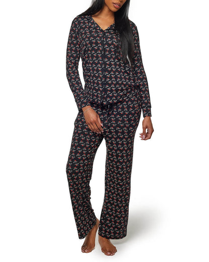 Black long pajamas featuring a floral print and a relaxed fit, perfect for comfortable lounging or sleep.