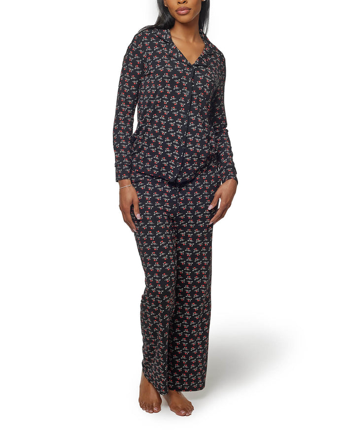 Black long pajamas featuring a playful floral print, designed for comfort and style for a cozy night in.