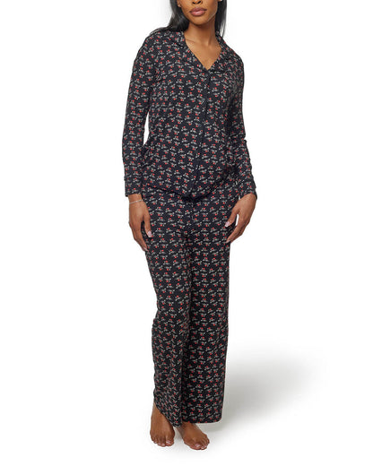 Black long pajamas featuring a playful floral print, designed for comfort and style for a cozy night in.