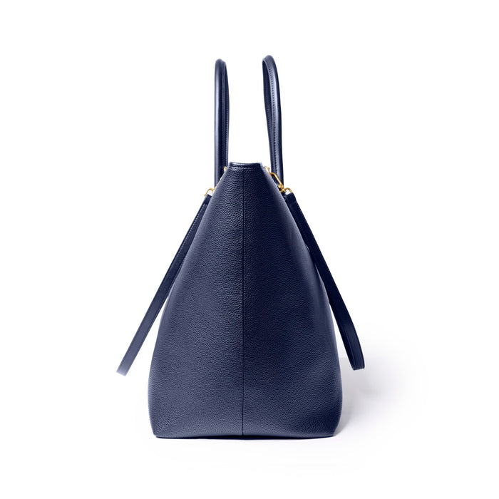 Navy jumbo pebble tote bag with structured design and dual handles for stylish everyday use.