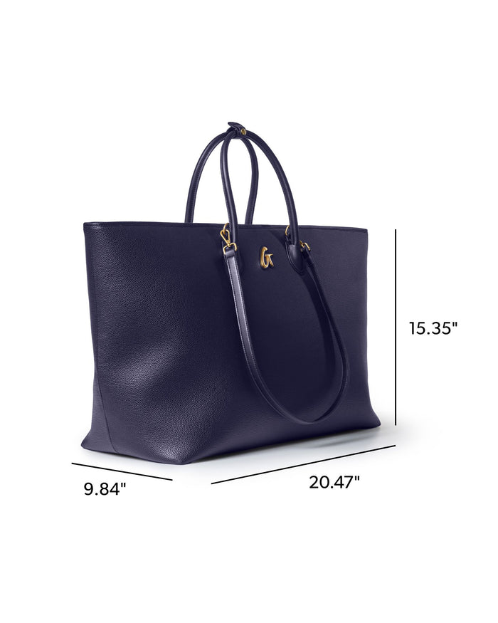 Navy jumbo pebble tote bag with gold accents, spacious design, and sturdy handles for stylish everyday use.