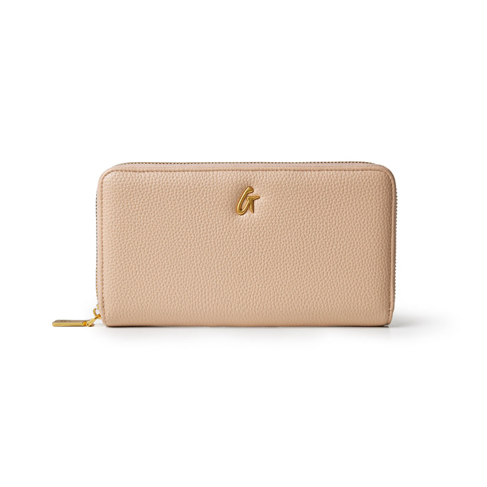 Nude jumbo pebble wallet featuring a textured finish and gold logo, designed for stylish organization and convenience.