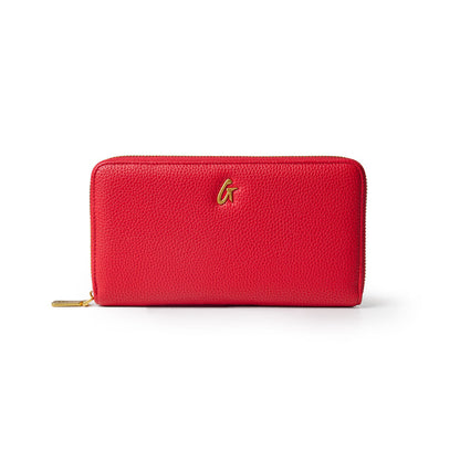Red jumbo pebble wallet with a textured finish and a gold logo, featuring a zip closure for secure storage.