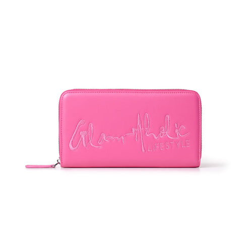 Hot pink wallet with a large signature logo and "LIFESTYLE" embroidered on the front, featuring a zipper closure.