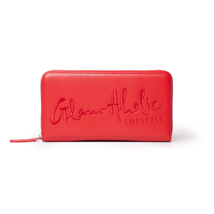 Red jumbo signature logo wallet with embossed "Glam-Aholic Lifestyle" text, zip-around closure, and sleek design.