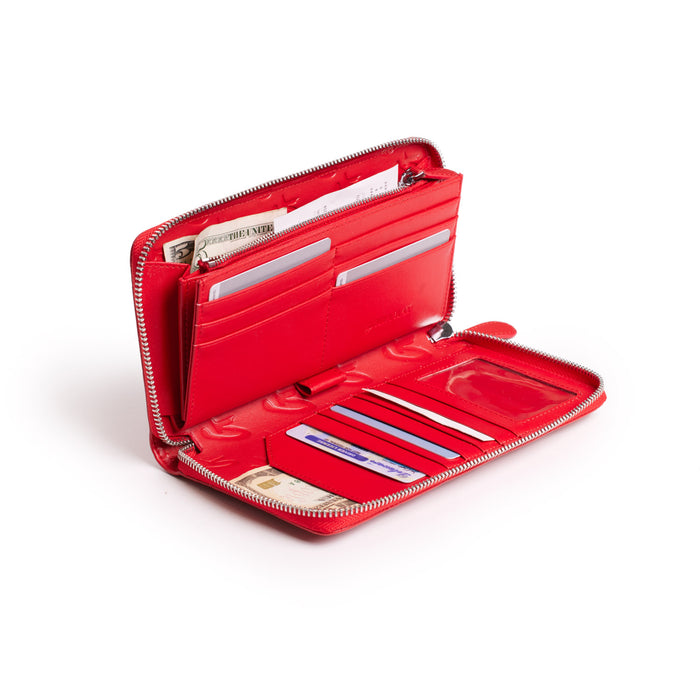 Red jumbo signature logo wallet open, showing multiple card slots, cash, and interior compartments.