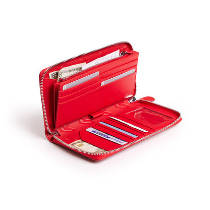 Red jumbo signature logo wallet open, showing multiple card slots, cash, and interior compartments.