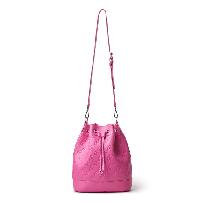 Large hot pink monogram bucket bag with embossed logo pattern and adjustable shoulder strap.