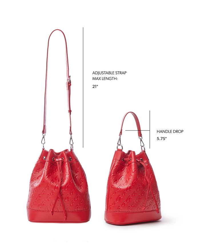 Large red monogram bucket bag with adjustable strap and 5.75-inch handle drop, perfect for stylish everyday use.
