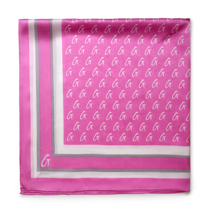 Large monogram silk scarf in soft pink featuring a repeating logo pattern and elegant border design.