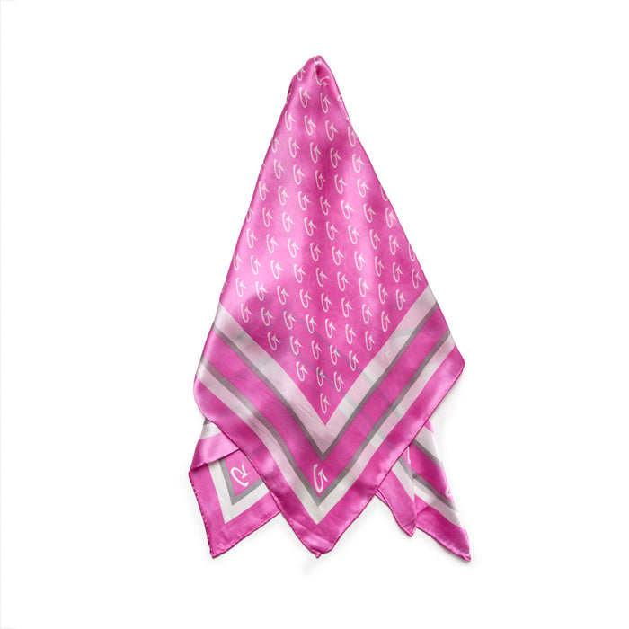 Soft pink large monogram silk scarf featuring a stylish pattern and elegant border, perfect for adding luxury to any outfit.