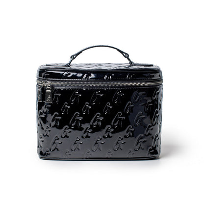 Large black monogram toiletry bag with a glossy finish, embossed with repeating "G" pattern and a top zipper closure.
