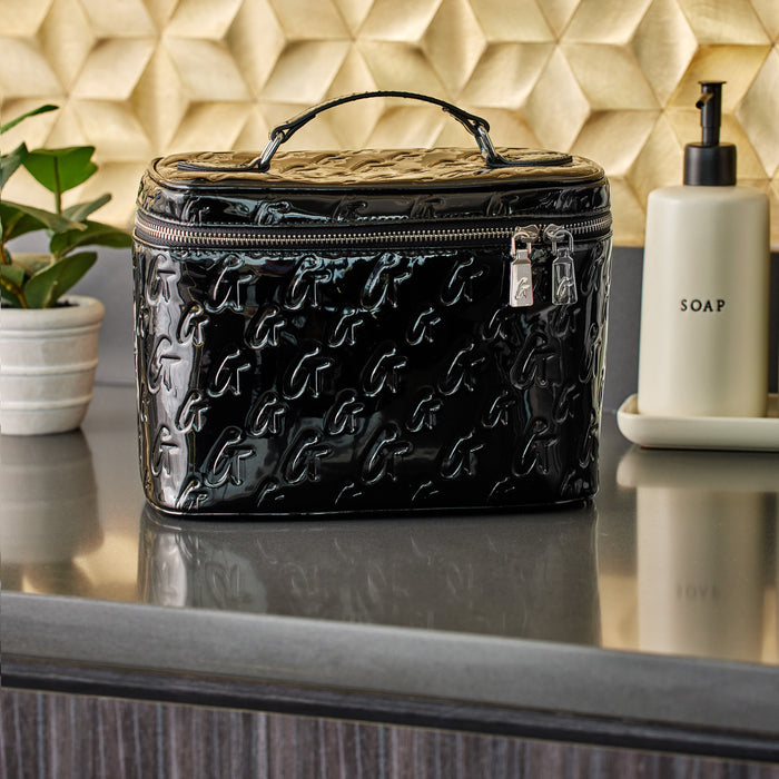 Large black monogram toiletry bag with a glossy finish, embossed with repeating "G" pattern, and a top handle.
