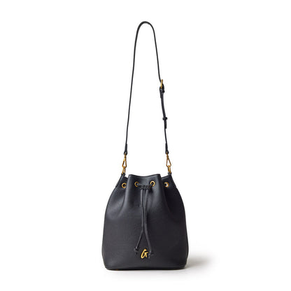 Black pebble bucket bag with a drawstring closure, gold accents, and an adjustable shoulder strap.