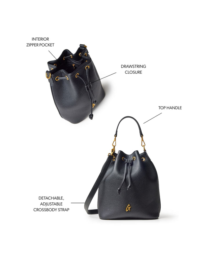 Large black pebble bucket bag featuring a drawstring closure, top handle, and detachable adjustable crossbody strap.