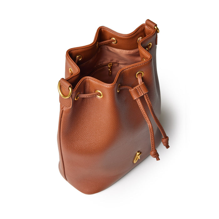Brown pebble-textured bucket bag with gold hardware, drawstring closure, and interior zip pocket, shown from above.