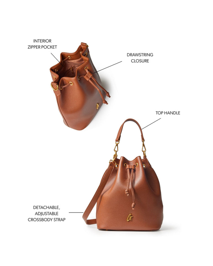 Large brown pebble bucket bag featuring a drawstring closure, top handle, and adjustable crossbody strap.
