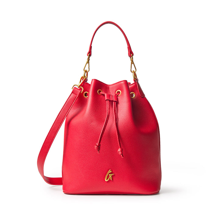 Large red pebble-textured bucket bag with gold hardware, adjustable strap, and drawstring closure.
