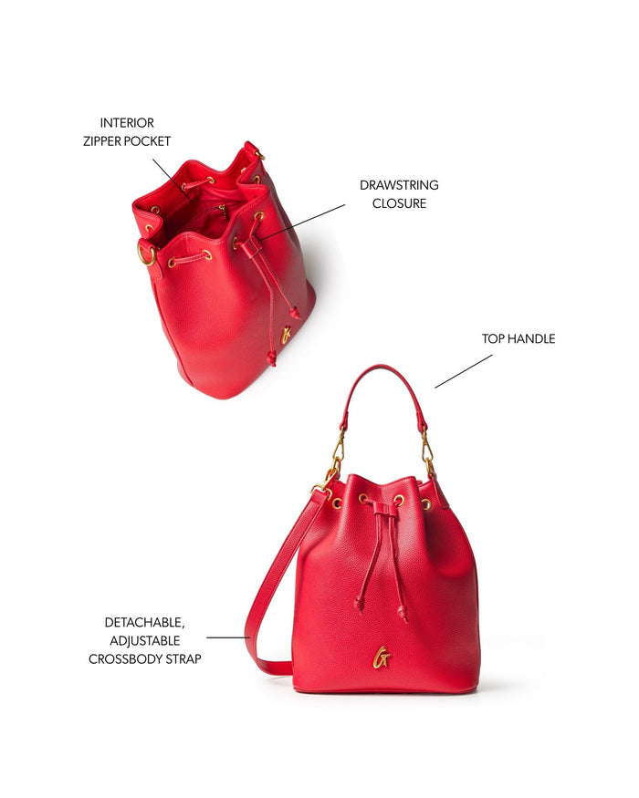 Large red pebble bucket bag featuring a drawstring closure, top handle, and detachable adjustable crossbody strap.