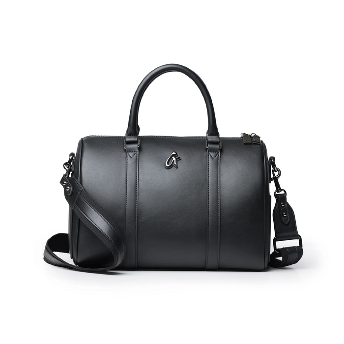 Large black Boston bag with a sleek design, featuring dual handles and a detachable shoulder strap.