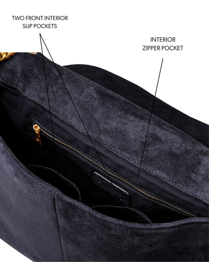 Large black suede flap bag featuring two front slip pockets and an interior zipper pocket for organized storage.