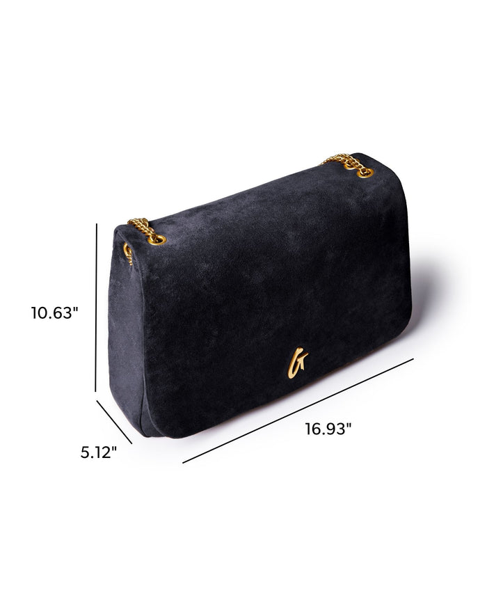 Large black suede flap bag with gold chain accents, measuring 16.93 inches wide, 10.63 inches high, and 5.12 inches deep.