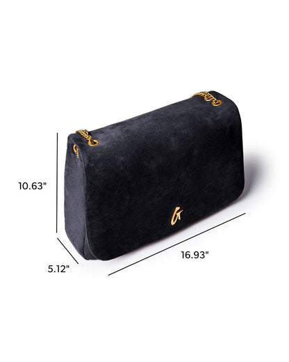 Large black suede flap bag with gold chain accents, measuring 16.93 inches wide, 10.63 inches high, and 5.12 inches deep.
