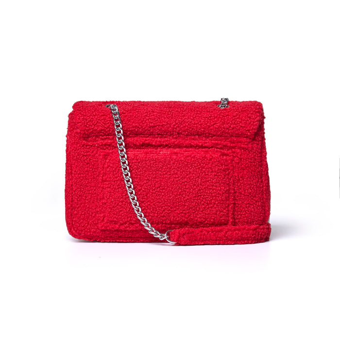 Large red teddy flap bag featuring a textured exterior and a silver chain strap, perfect for stylish everyday use.