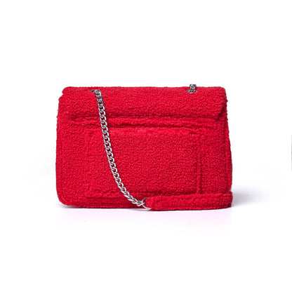 Large red teddy flap bag featuring a textured exterior and a silver chain strap, perfect for stylish everyday use.