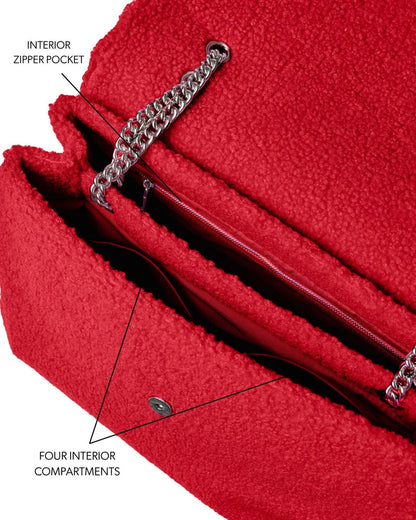 Large red teddy flap bag featuring an interior zipper pocket and four spacious compartments for organized storage.